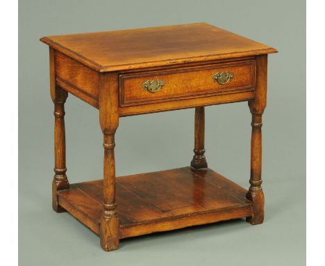 A Chapman's Siesta Furnishings oak side table, with single drawer, turned legs and low shelf.  Width 61 cm. 