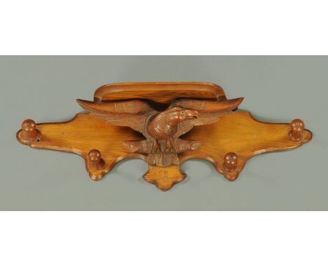 A Victorian carved eagle hall coat rack, with shelf above.  Width 80 cm. 