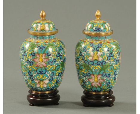 A pair of Hua Yi Cloisonne vases and covers, mid 20th century, with gilded finial decorated with ruyi heads, lotus flowers an