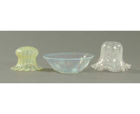 An opalescent glass fruit bowl with moulded decoration and registration number 777135 and two early 20th century table light 