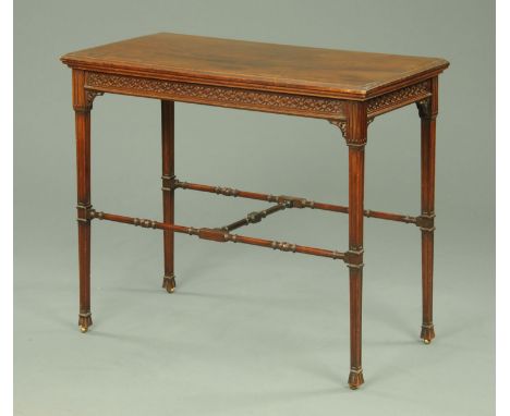 A late 19th/early 20th century Gillow & Co. mahogany turnover top card table, with blind fretwork frieze, raised on tapered l