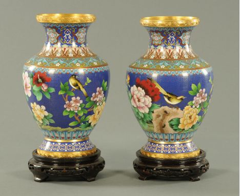 A large pair of Chinese cloisonne vases, 20th century, decorated with birds amongst peony and rock work between ruyi head pen