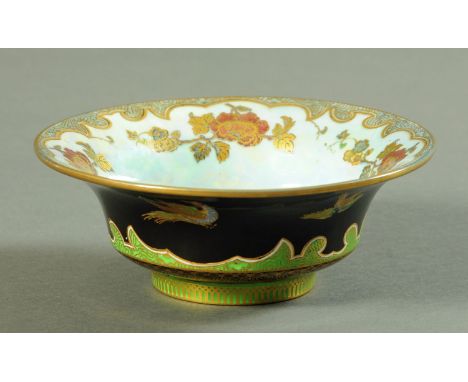 A Wedgwood lustreware pheasant decorated small bowl.  Diameter 16.5 cm.    CONDITION REPORT:  Gives out a dull ring when tapp