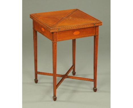 An Edwardian inlaid mahogany square envelope card table, boxwood strung and raised on tapered legs of square section with low