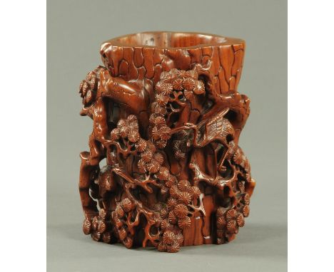 A Chinese carved hardwood brush pot, mid 20th century, intricately carved from one piece with, cranes amongst pine trees and 