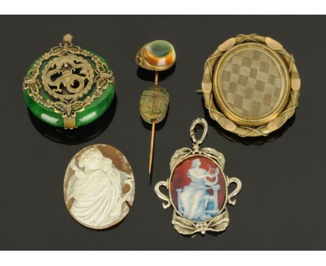 A silver mounted enamelled pendant, a Tibetan jade pendant with dragon motif, a reversible hair brooch, an antique cameo and 