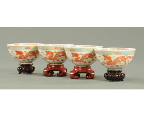 A set of four Chinese tea bowls, early Republic period, the interior decorated with a red dragon its claws and eyes picked ou