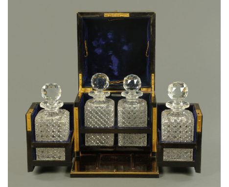 A Coromandel wood and gilt metal strung four bottle decanter box, mid 19th Century, of typical form, the interior plush lined