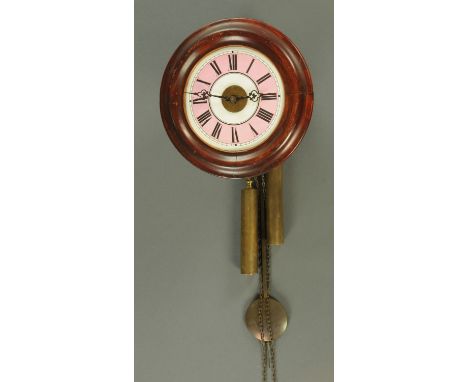 A Victorian postman's alarm wall clock, with pink and white tin dial, diameter of case 28 cm.