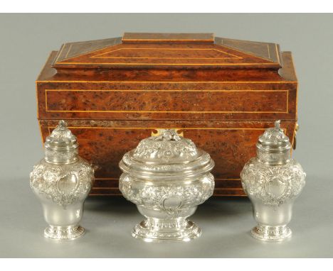 A George II set of three silver caddies, by Samuel Courtauld, a Huguenot silversmith, London 1749, and comprising one oval su