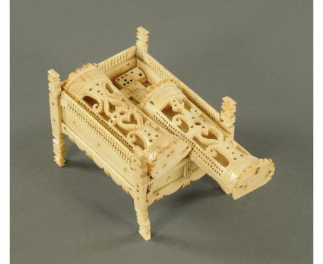 A Napoleonic prisoner of war carved bone double domed domino box, housing 75 painted dominoes beneath two sliding lids, each 