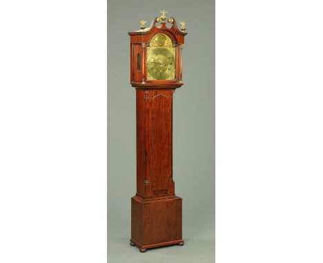 A mahogany grandmother clock, with eagle and ball finial, swans neck pediment and arched glazed door enclosing the 27 cm wide