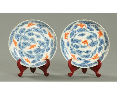 A pair of Chinese porcelain dished plates, Republic period, decorated and underglaze blue with Ruyi shaped clouds and with si