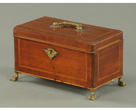 A George III mahogany caddy, boxwood and ebony strung with brass feet and handle.  Width 25 cm.   CONDITION REPORT:  Upon fir