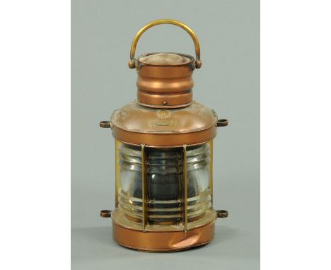 A brass and copper ships lantern, with carrying handle, bearing plaques "Starboard", "Masthead" and "Port".  Height including