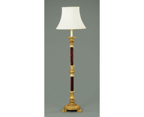 A late 19th/early 20th century carved and giltwood lamp standard, with applied velvet to the columns.