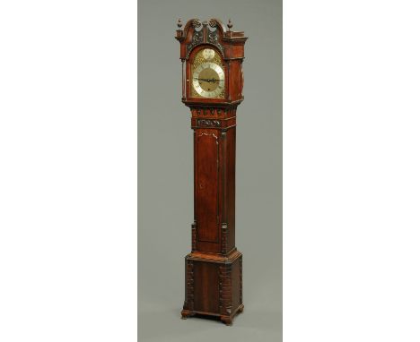A mahogany cased grandmother clock, with spring driven three-train movement striking on four gongs, with slim trunk door and 