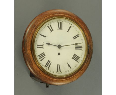 A late Victorian school type wall clock, with single train spring driven movement in a mahogany case, with pendulum.  Diamete