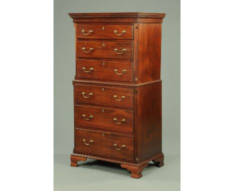 A mahogany tallboy, in two sections, with moulded dentil cornice and three drawers to each section with brass drop handles an