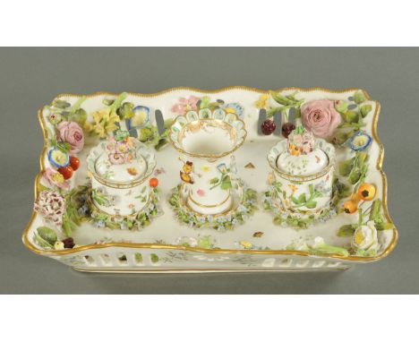 A Meissen style porcelain ink stand, with two inkwells and spill vase, floral and fruit encrusted.  Width 32.5 cm (see illust