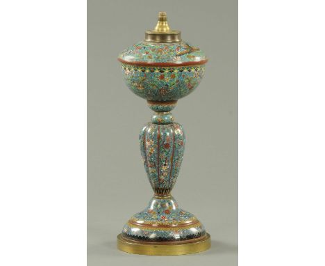 A Japanese cloisonne oil lamp, early Meiji period, decorated throughout with phoenix amongst blossoming flowers against a blu