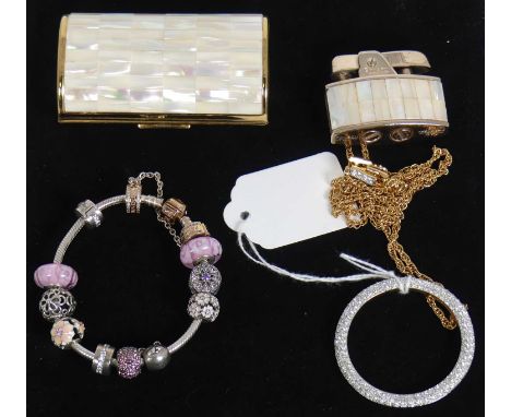A Pandora bracelet containing numerous Pandora charms, with two pouches; together with a modern gilt metal white crystal set 