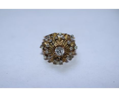 Ladies 14ct Gold Tested Diamond Cluster ring with 0.45ct Claw set Diamond surrounded in Claw set Diamonds. 7.9g total weight 