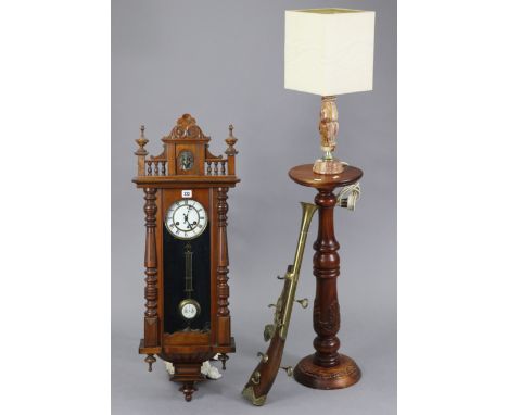 A reproduction Vienna-type wall clock in walnut-finish case, 38” high; together with a reproduction torchere, 29½” high; a ta