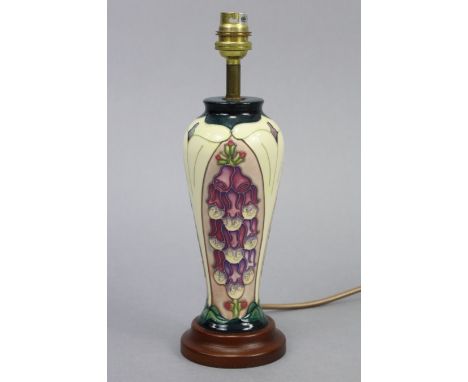 A Moorcroft pottery ovoid table lamp in the traditional-style, with shade 19” high (overall).