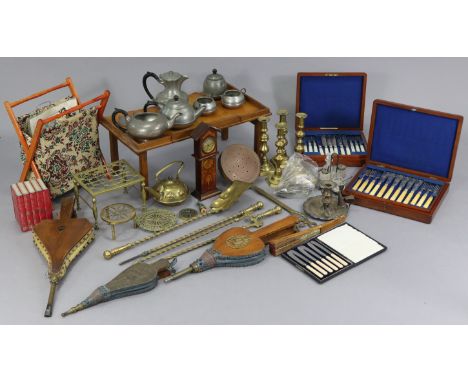 A set of three brass fire implements with spiral-twist handles; two pairs of fire bellows; a reproduction miniature longcase 