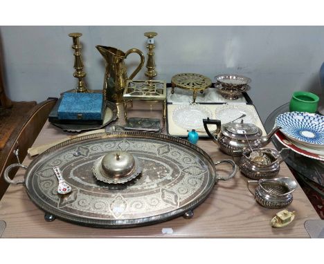 A pair of brass ejector candlesticks, 10¾” high; a silver-plated three -piece tea service; a silver-plated oval two-handled t