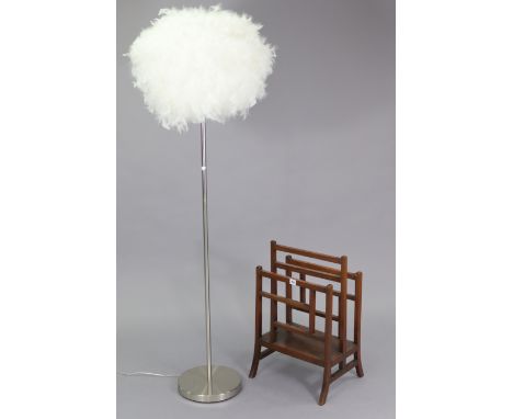 A mahogany two-division magazine rack, 15½” wide; &amp; a silvered-metal standard lamp with white feather shade.