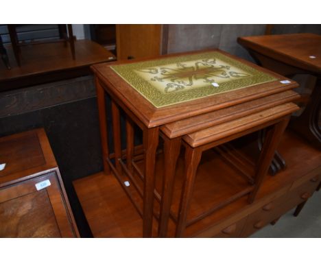 A vintage teak and tile top nest of three tables, stamped Denmark