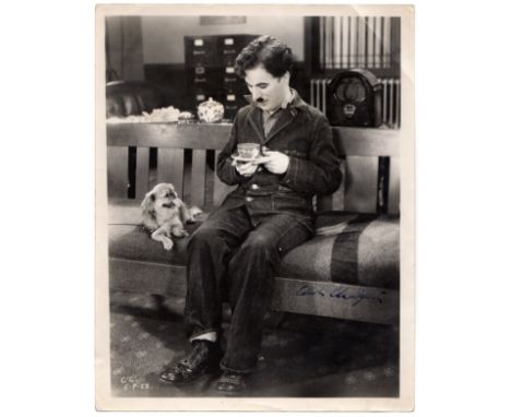 CHAPLIN CHARLES: (1889-1977) English Film Comedian, Academy Award winner. A good vintage signed 7 x 9.5 photograph by Chaplin