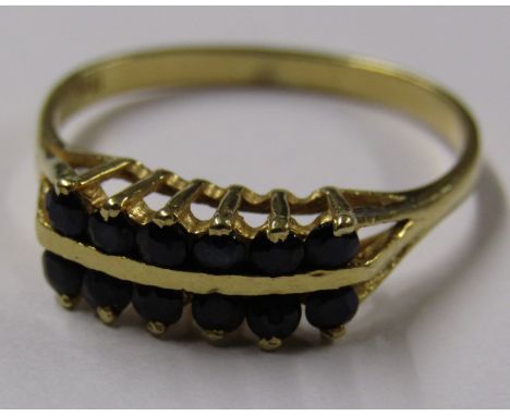 18ct gold ring with 12 inky sapphires set in two rows - ring size P - total weight 2.6g