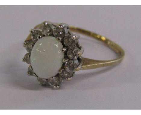 9ct gold ring with cabochon milky opal surrounded by faux diamonds - ring size P - total weight 2.1g