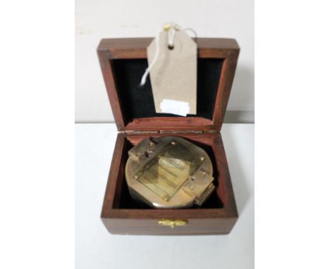 A brass cased natural sine compass in fitted box 