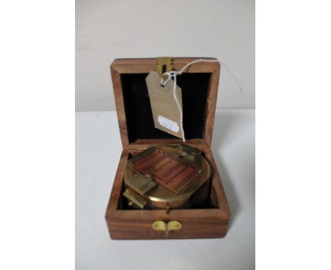 A brass cased natural sine compass by Stanley of London in fitted box 