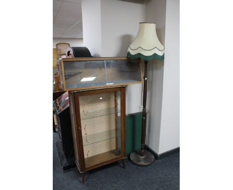 A mid century display cabinet together with further sliding door display cabinet, occasional table and standard lamp with sha