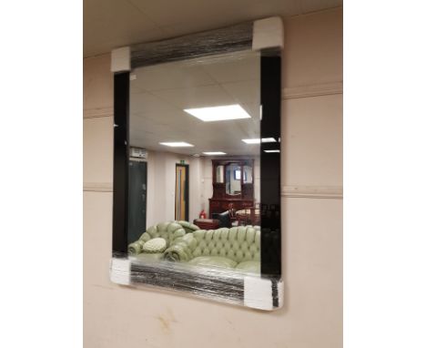 A contemporary black glass framed mirror, 85.5 cm x 116 cm 