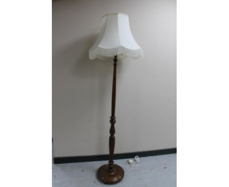 A beech standard lamp with shade 