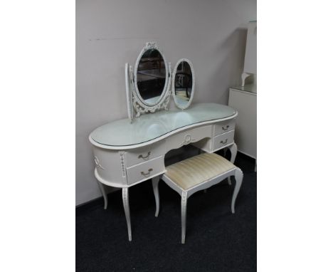 A white French style kidney shaped dressing table with triple mirror and stool 