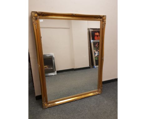 A gilt framed traditional style mirror, 106 cm x 136 cm 