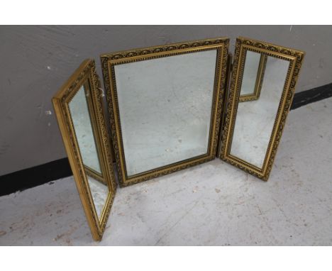 A gilt framed triple mirror