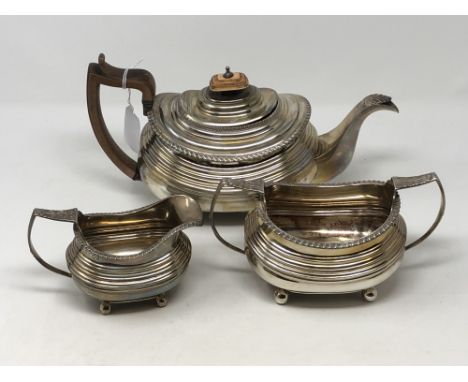 A Georgian silver three piece tea set comprising teapot, milk jug and sugar bowl, maker WB, London 1821 CONDITION REPORT: 109