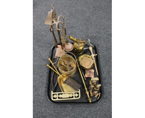 A tray of antique and later brass and metal ware, four piece companion set on stand, hearth brush and shovel, primus blow lam
