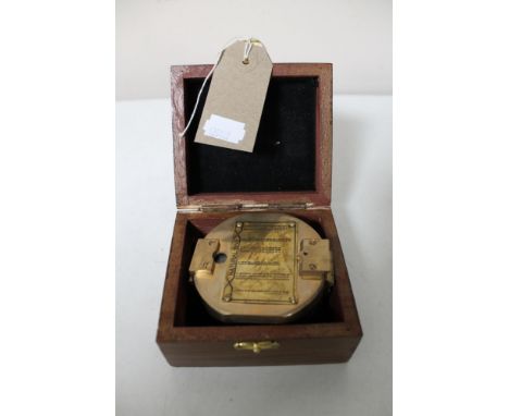 A brass cased natural sine compass in fitted box 