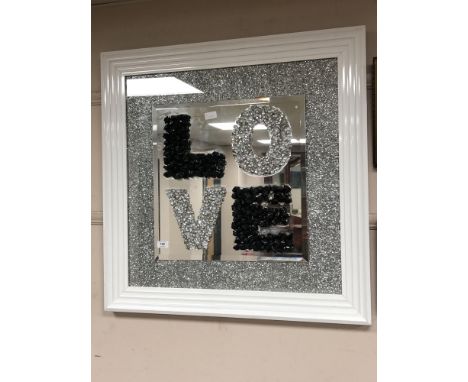 A contemporary framed 'Love' mirror 