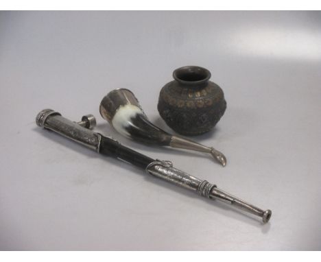 A middle Eastern silvered and brass vase, a white metal mounted horn and a pipe  