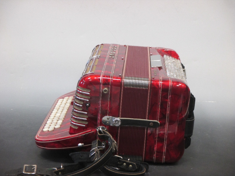 A Hohner Shand Morino 46 button accordion, together with Hohner hard